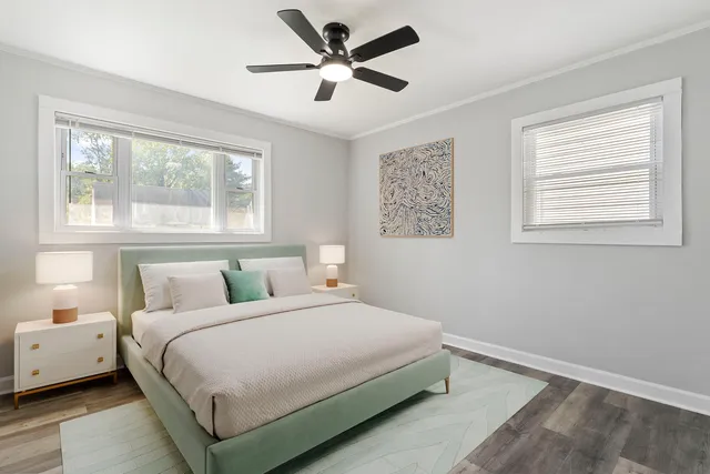 a bedroom with a large bed and a window