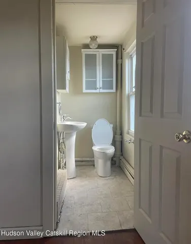 a bathroom with a toilet and a sink