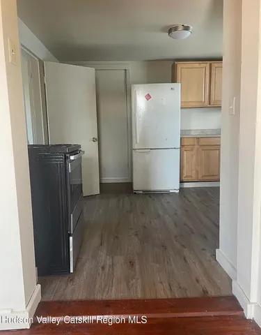 a view of kitchen with wooden floor