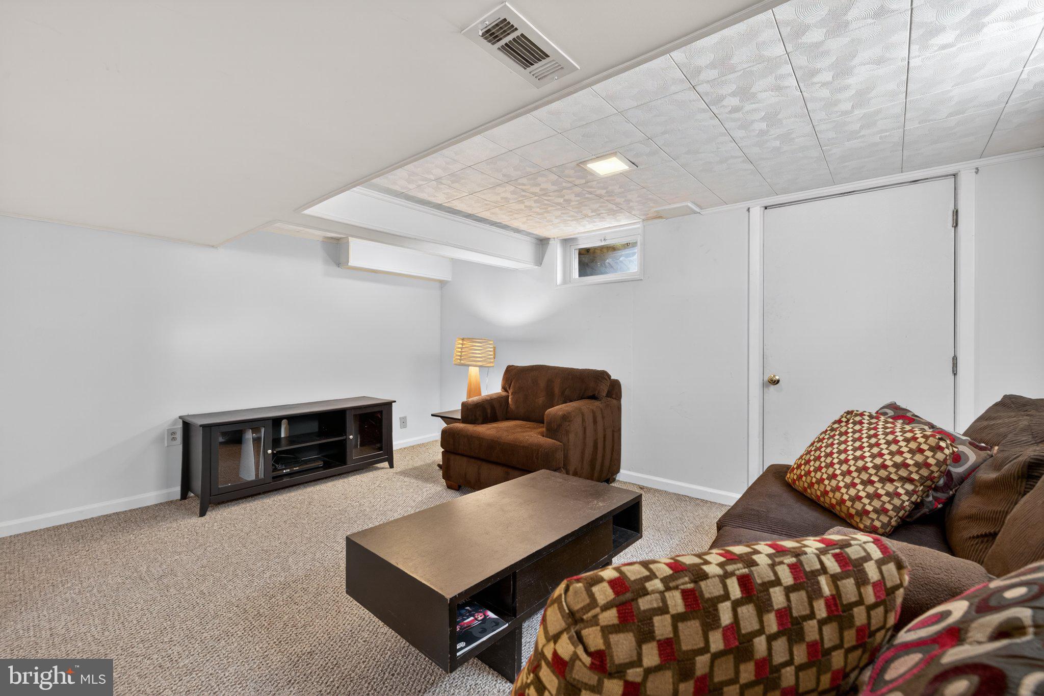1002 Wilson Place Frederick, MD 21702 - Photo 23 of 30 a bedroom with furniture and a fireplace