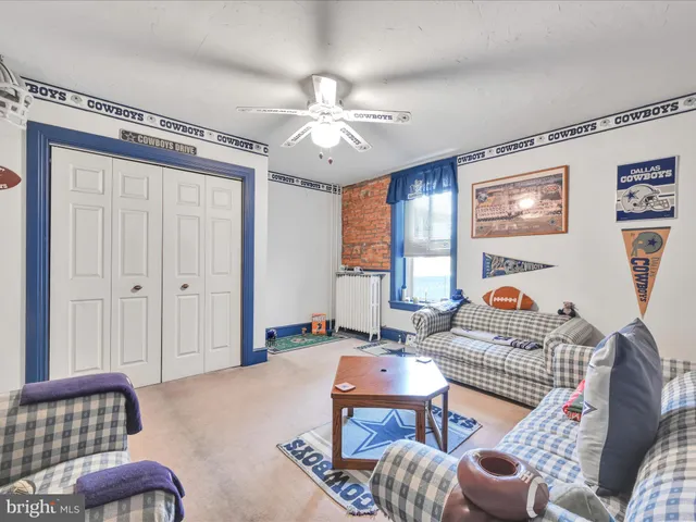 a living room with furniture a table and a window