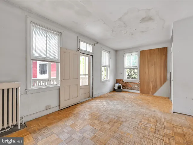 a view of empty room with windows