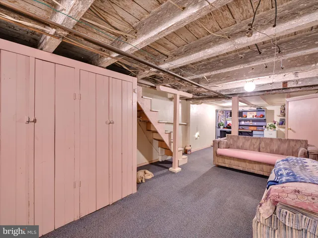 a view of an empty room with white walls