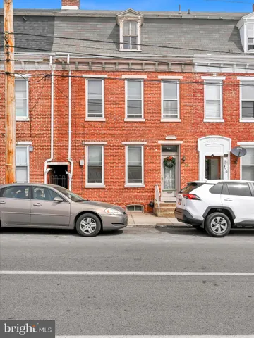 a view of a car parked in front of a house