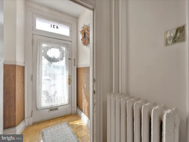 a view of front door with a mirror