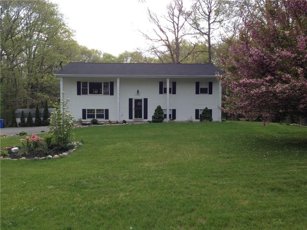 3055 David Avenue Killingly, CT 06239 - Photo 1 of 1 a front view of house with yard and green space