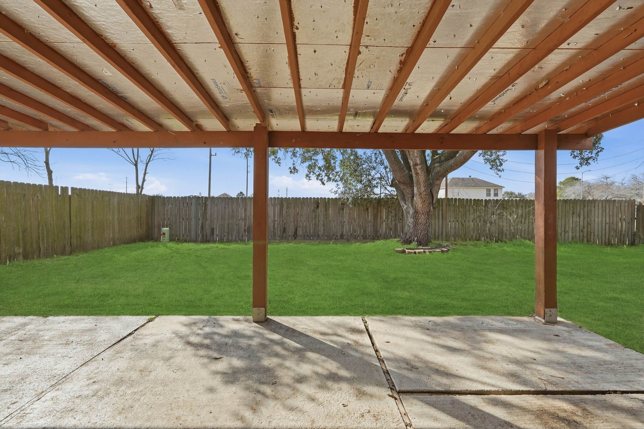 17223 Ranch Country Road Hockley, TX 77447 - Photo 28 of 36 Your back patio is covered, with plenty of space to relax and enjoy no matter the weather *grass is artificially enhanced in the outdoor photos.