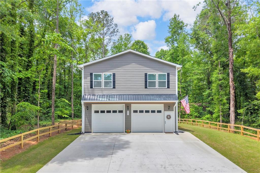 397 Normandy Trail Lavonia, GA 30553 - Photo 1 of 47 a view of a house with a yard and a large tree