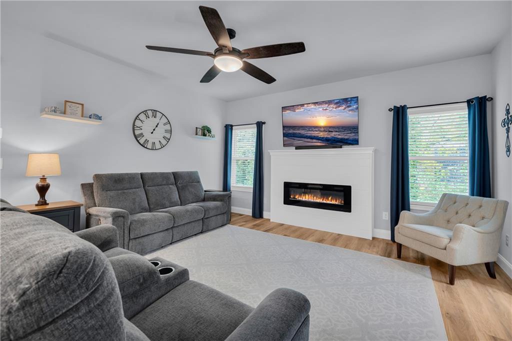 397 Normandy Trail Lavonia, GA 30553 - Photo 11 of 47 a living room with furniture or couch and a fireplace