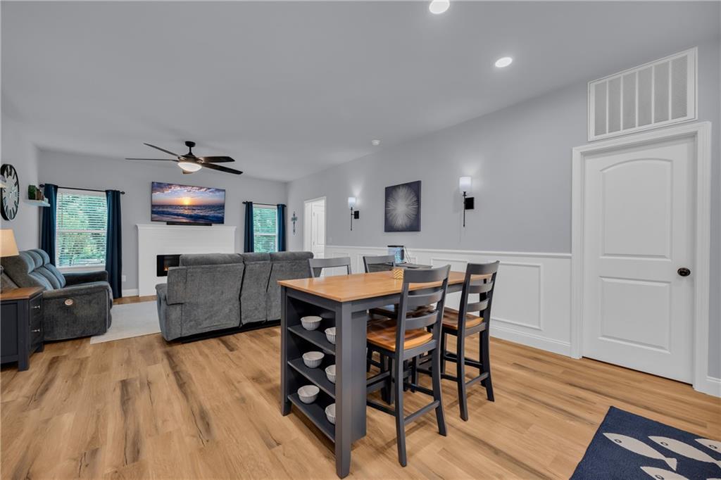 397 Normandy Trail Lavonia, GA 30553 - Photo 13 of 47 a view of a dining room with furniture and wooden floor
