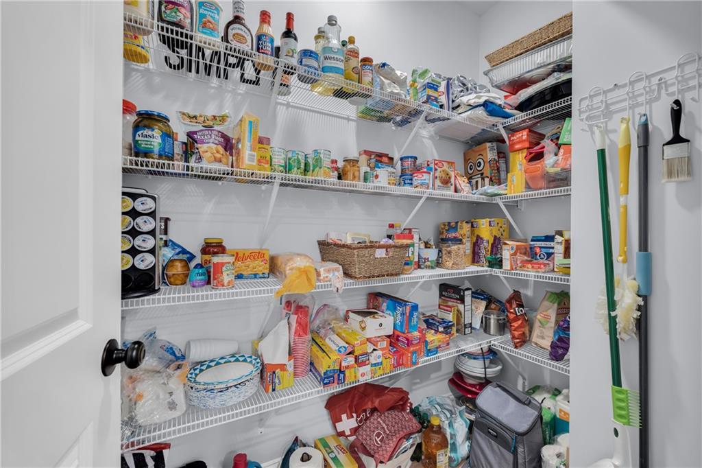 397 Normandy Trail Lavonia, GA 30553 - Photo 20 of 47 a store room with lots of clutter and cabinets