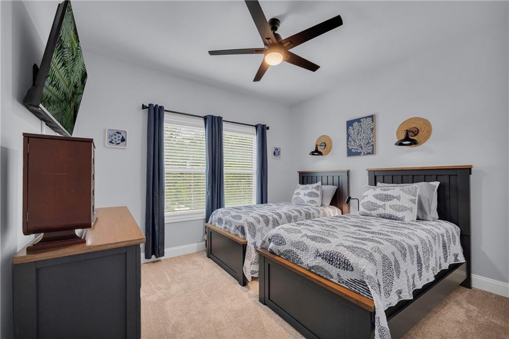 397 Normandy Trail Lavonia, GA 30553 - Photo 22 of 47 a bedroom with a bed and a flat screen tv