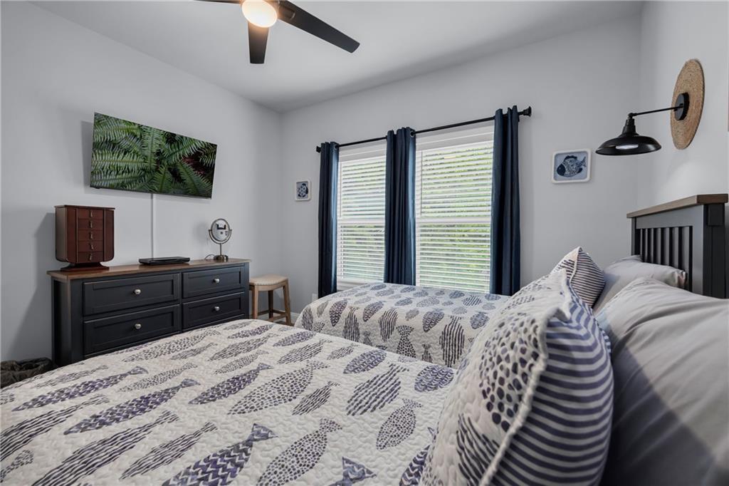 397 Normandy Trail Lavonia, GA 30553 - Photo 23 of 47 a bedroom with a bed and a flat screen tv