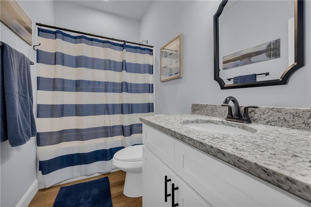 397 Normandy Trail Lavonia, GA 30553 - Photo 24 of 47 a bathroom with a sink and a mirror