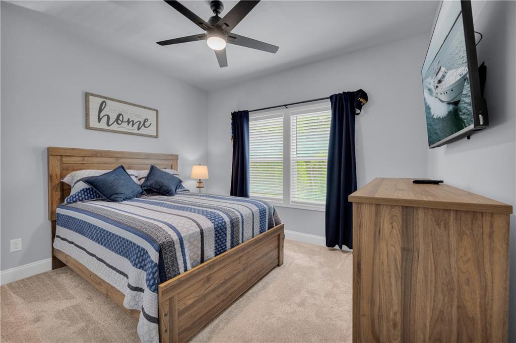 397 Normandy Trail Lavonia, GA 30553 - Photo 26 of 47 a bedroom with a bed and a window
