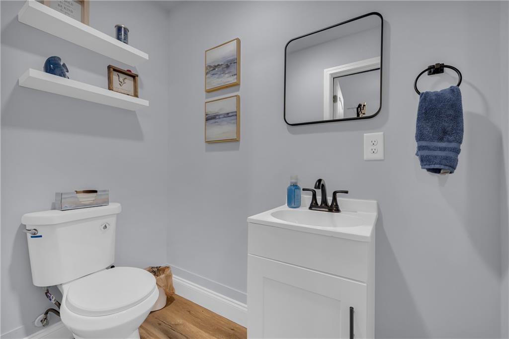 397 Normandy Trail Lavonia, GA 30553 - Photo 28 of 47 a bathroom with a toilet sink and mirror