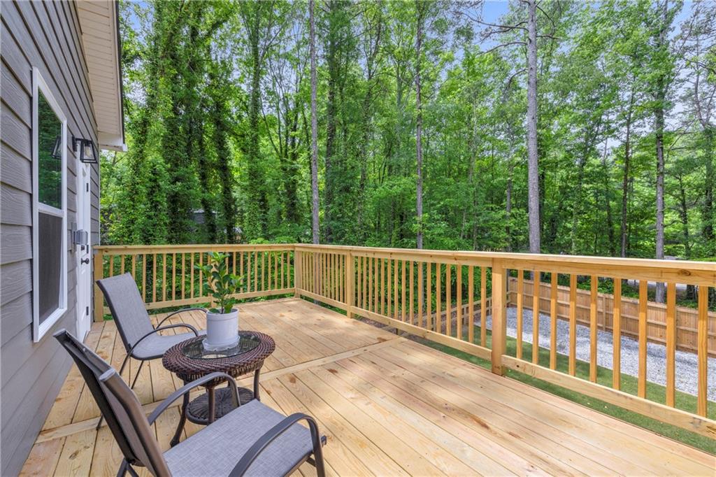 397 Normandy Trail Lavonia, GA 30553 - Photo 31 of 47 a view of a chair and table on the deck
