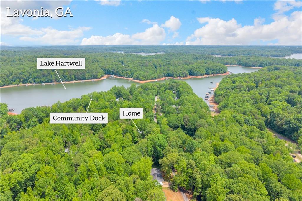 397 Normandy Trail Lavonia, GA 30553 - Photo 43 of 47 a view of a sign board with a lake view