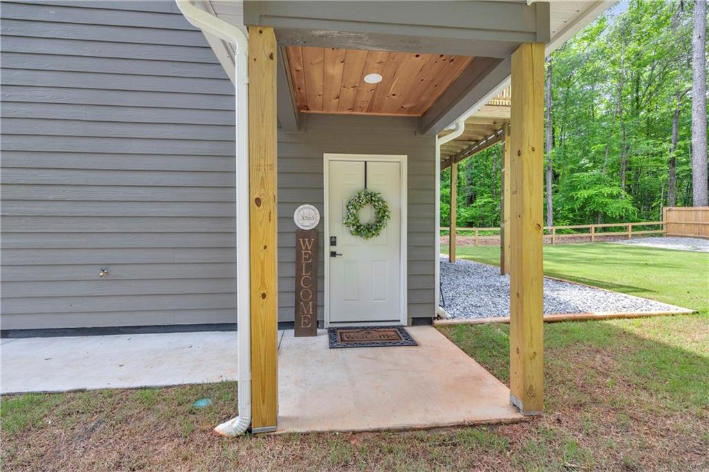 397 Normandy Trail Lavonia, GA 30553 - Photo 7 of 47 a view of a house with backyard and porch