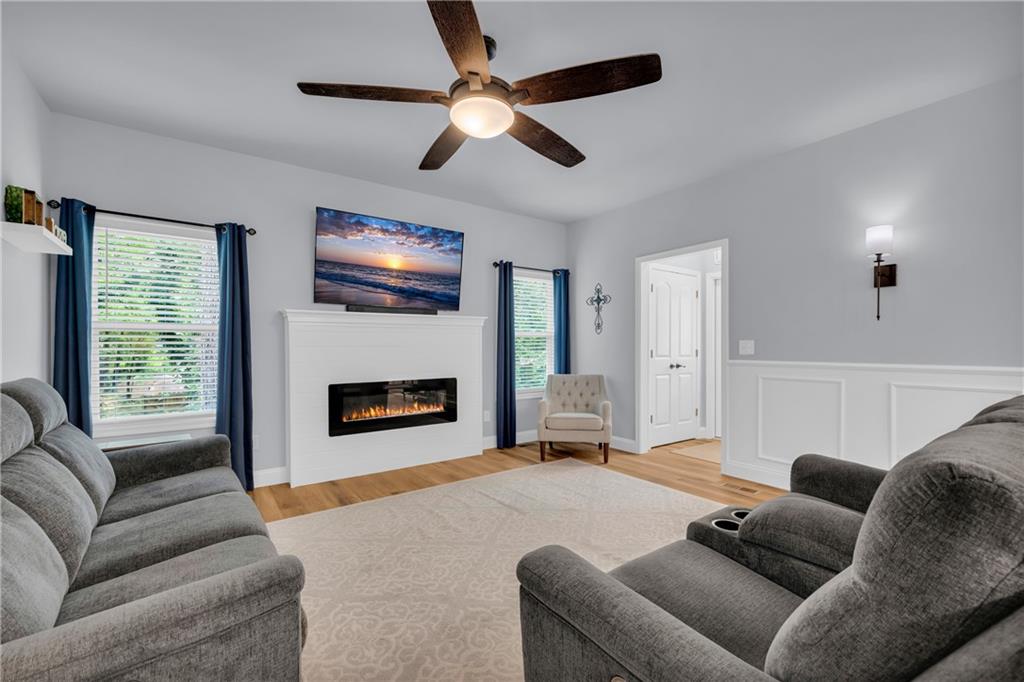 397 Normandy Trail Lavonia, GA 30553 - Photo 9 of 47 a living room with furniture and a fireplace