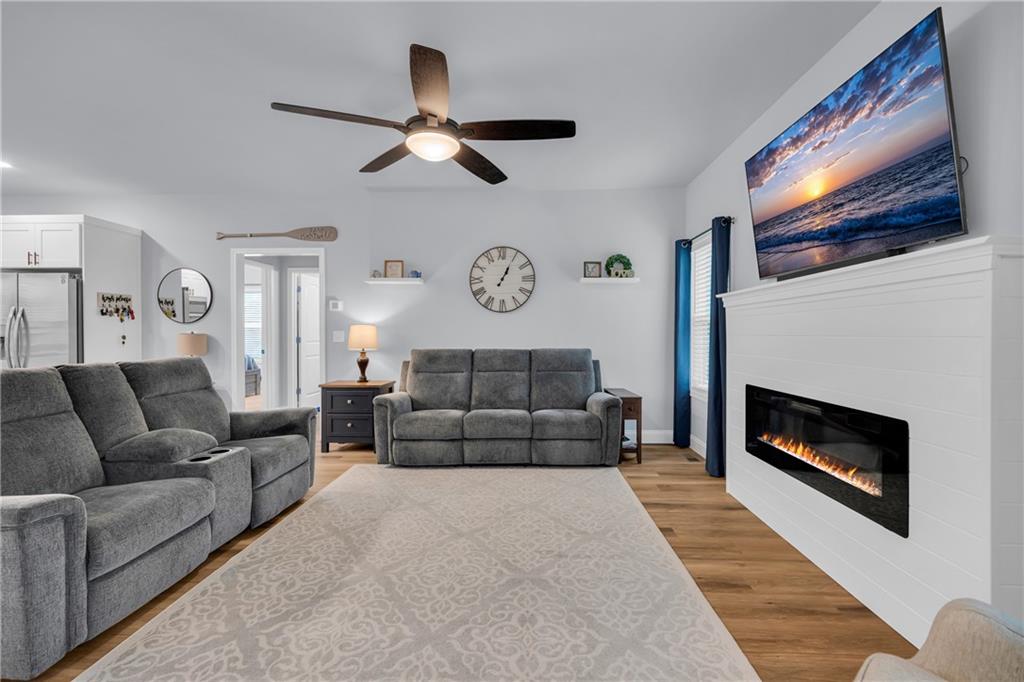 397 Normandy Trail Lavonia, GA 30553 - Photo 10 of 47 a living room with furniture and a fireplace