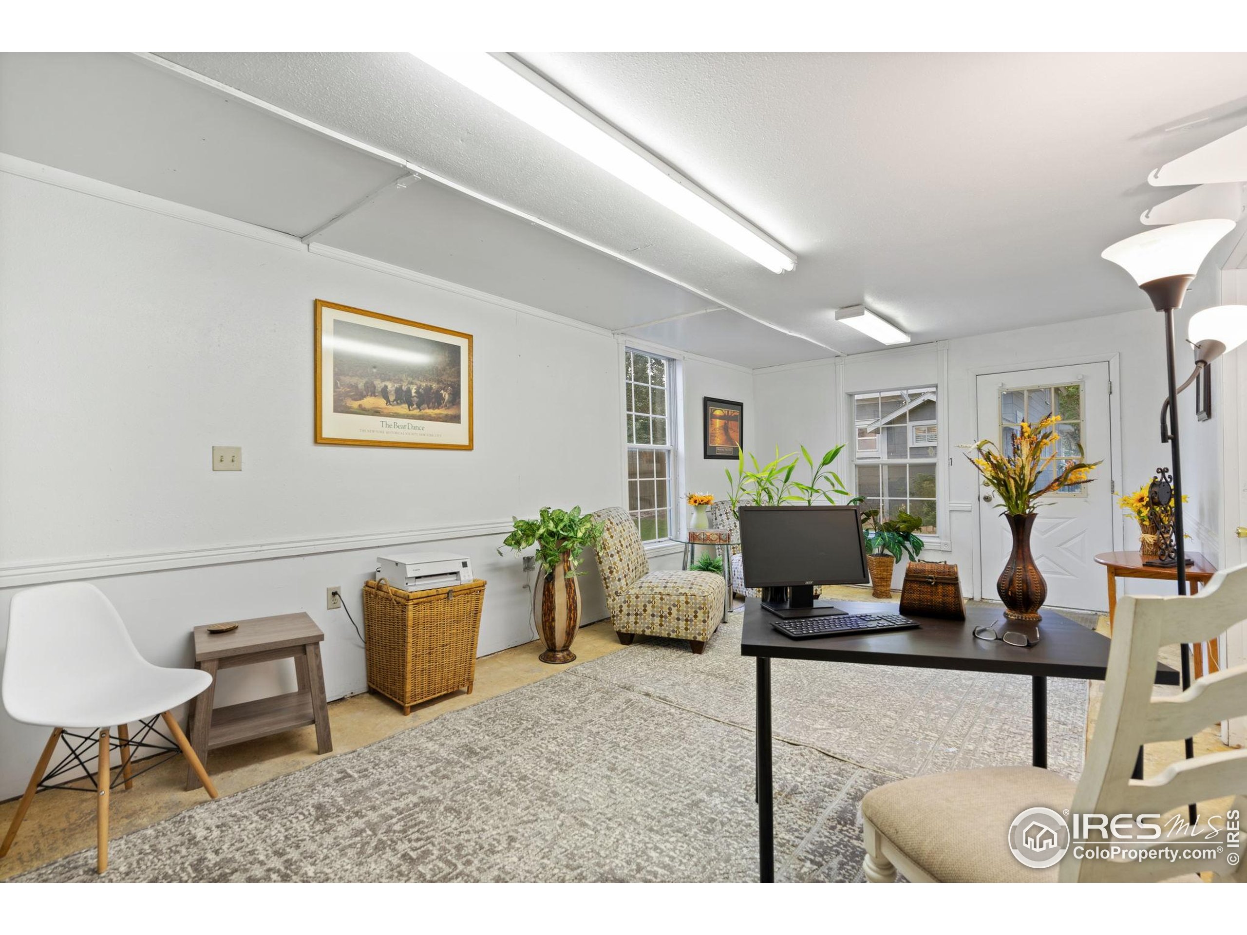 322 Maple Avenue Eaton, CO 80615 - Photo 19 of 26 a living room with furniture and a potted plant