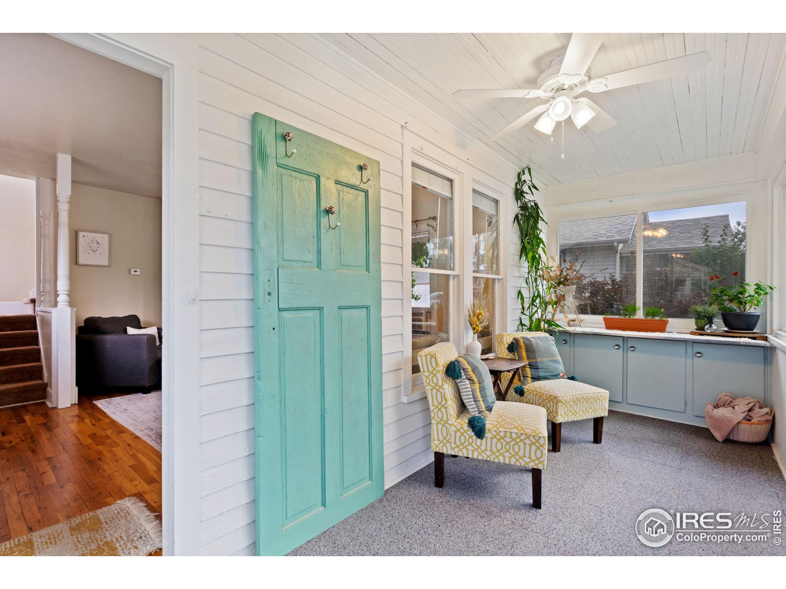 322 Maple Avenue Eaton, CO 80615 - Photo 24 of 26 a living room with furniture and a large window