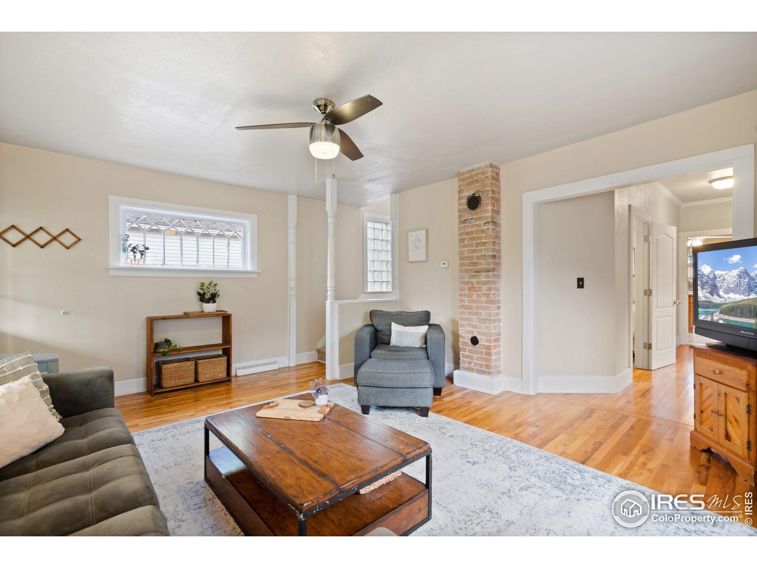 322 Maple Avenue Eaton, CO 80615 - Photo 4 of 26 a living room with furniture and a wooden floor