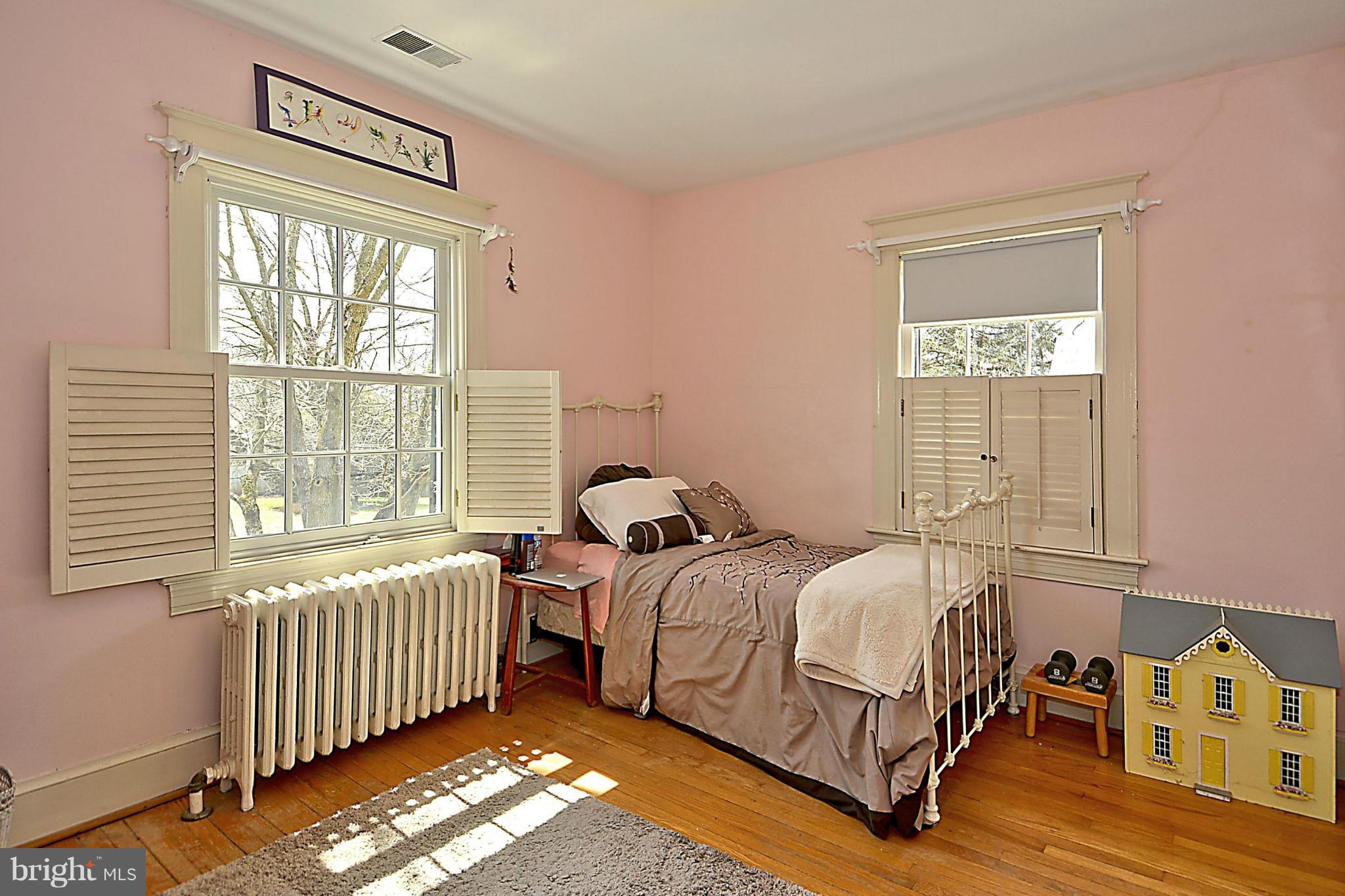 1909 Stratton Road Silver Spring, MD 20910 - Photo 15 of 22 a bedroom with a bed and a window