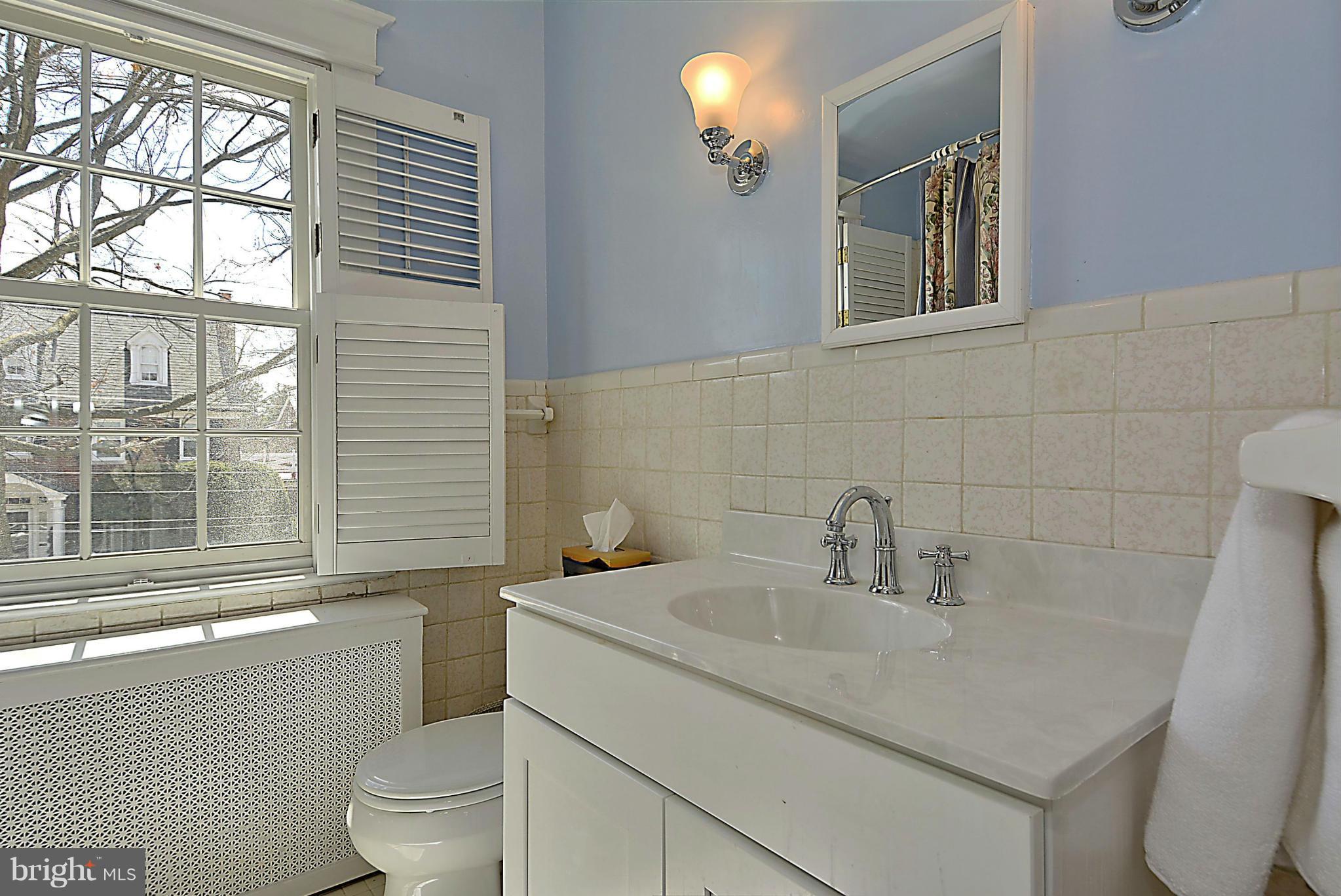 1909 Stratton Road Silver Spring, MD 20910 - Photo 16 of 22 a bathroom with a sink a toilet and a bathtub