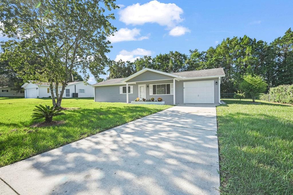 10314 Southeast 175th Place Summerfield, FL 34491 - Photo 1 of 25 a view of a house with a backyard