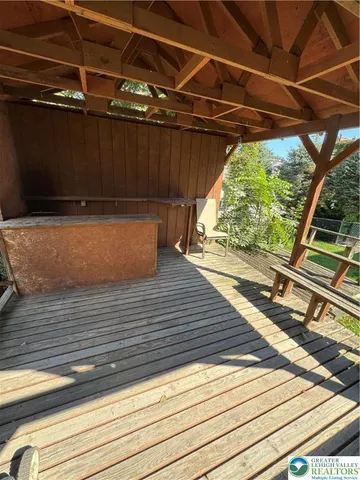 a view of a wooden deck with a bench