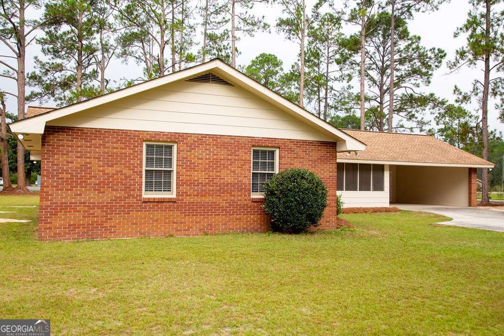 503 Satilla Church Road Baxley, GA 31513 - Photo 12 of 70 a view of a house with a yard