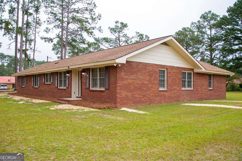 503 Satilla Church Road Baxley, GA 31513 - Photo 16 of 70 a front view of a house with a garden