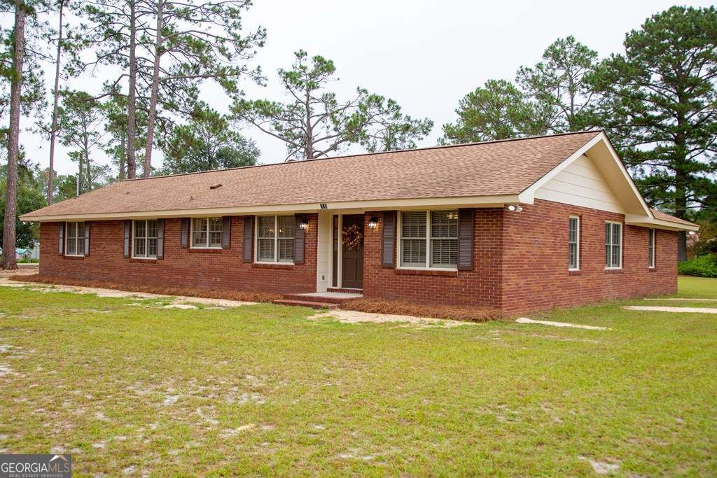 503 Satilla Church Road Baxley, GA 31513 - Photo 19 of 70 a front view of a house with a garden