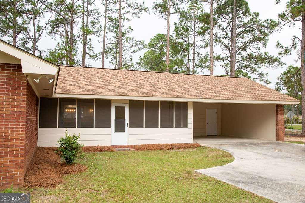 503 Satilla Church Road Baxley, GA 31513 - Photo 26 of 70 a house with trees in the background