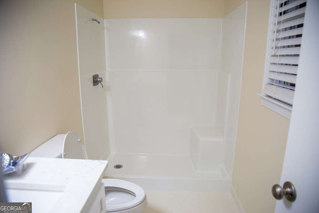 503 Satilla Church Road Baxley, GA 31513 - Photo 31 of 70 a bathroom with a shower and a toilet