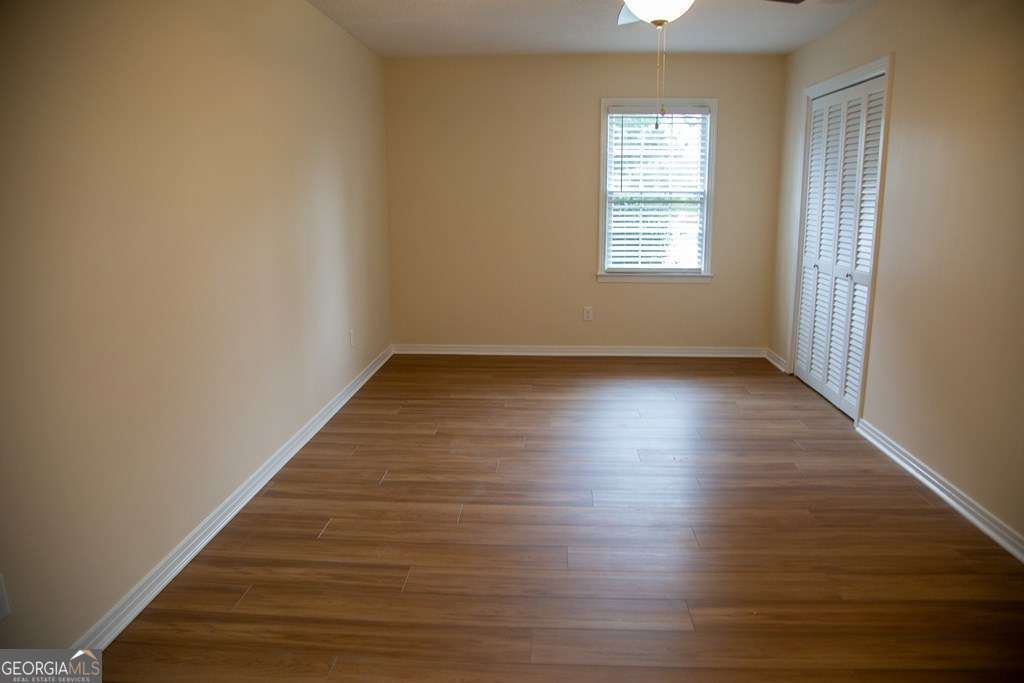 503 Satilla Church Road Baxley, GA 31513 - Photo 32 of 70 wooden floor in an empty room with a window