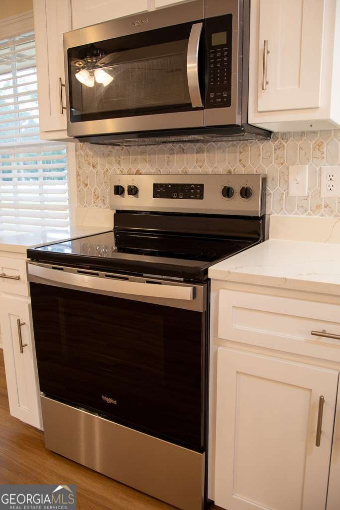 503 Satilla Church Road Baxley, GA 31513 - Photo 44 of 70 a stove top oven sitting inside of a kitchen