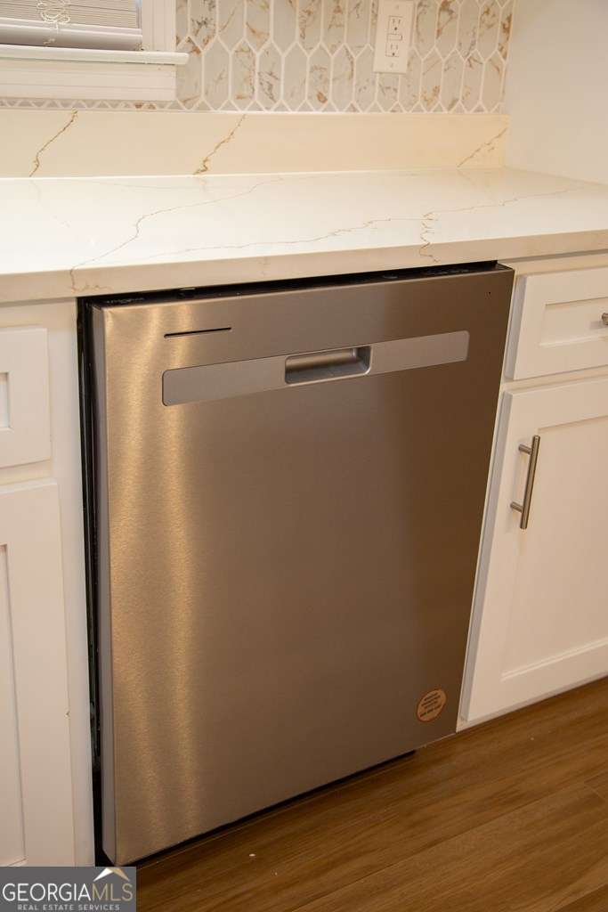 503 Satilla Church Road Baxley, GA 31513 - Photo 45 of 70 a close up of a refrigerator with wooden floor