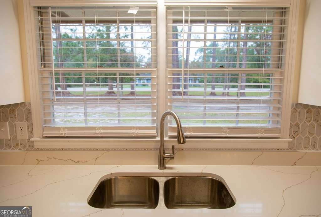 503 Satilla Church Road Baxley, GA 31513 - Photo 46 of 70 a bathroom with a sink and next to a window