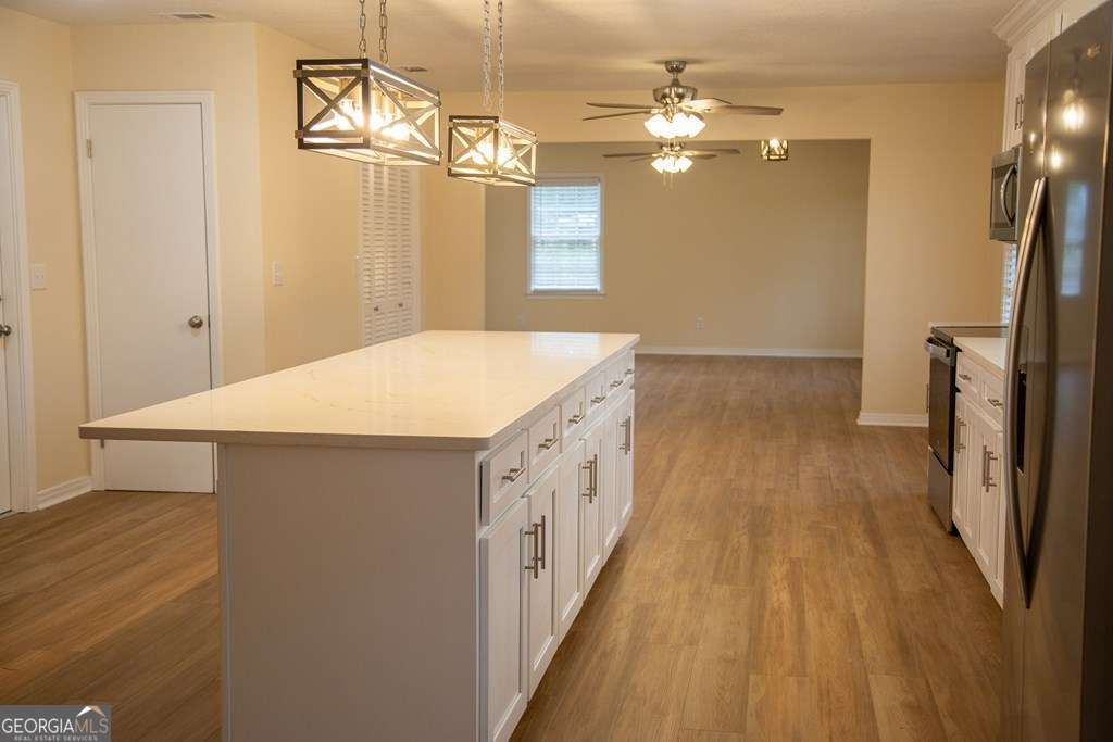 503 Satilla Church Road Baxley, GA 31513 - Photo 55 of 70 a bathroom with a sink a mirror and a shower