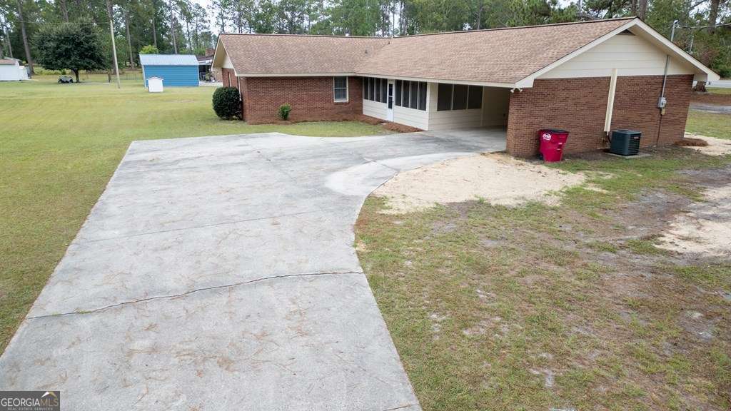 503 Satilla Church Road Baxley, GA 31513 - Photo 58 of 70 a view of a house with a yard and a patio