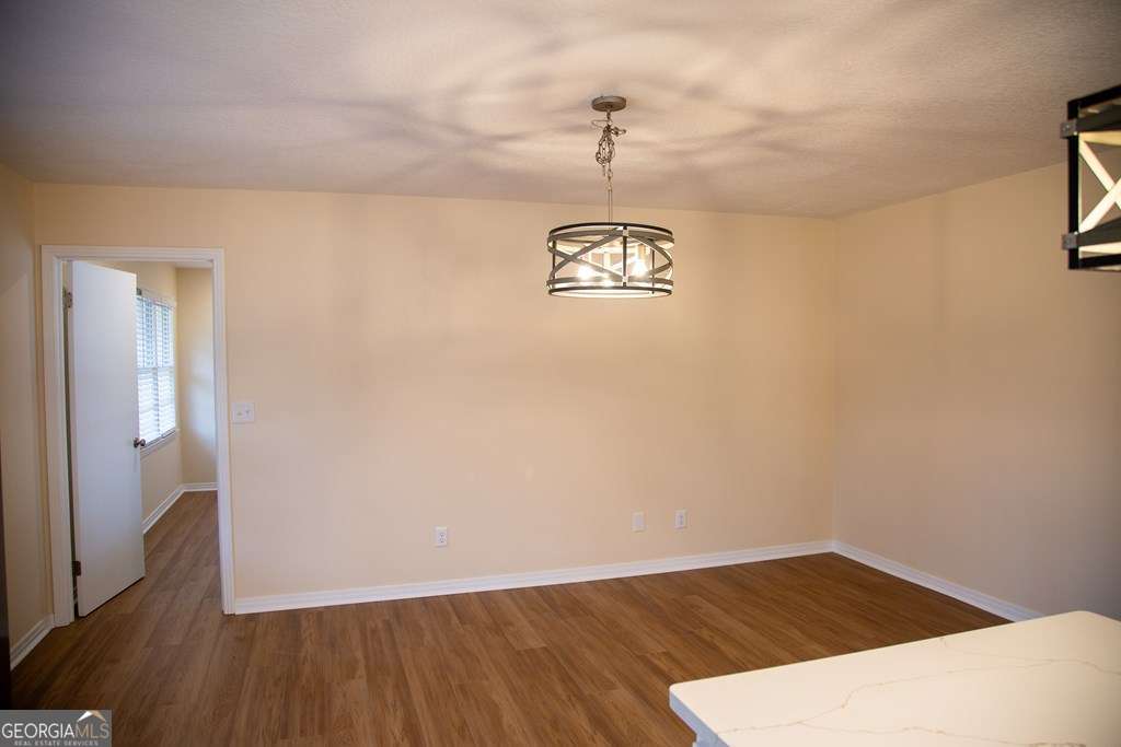 503 Satilla Church Road Baxley, GA 31513 - Photo 8 of 70 a view of a room with wooden floor and staircase