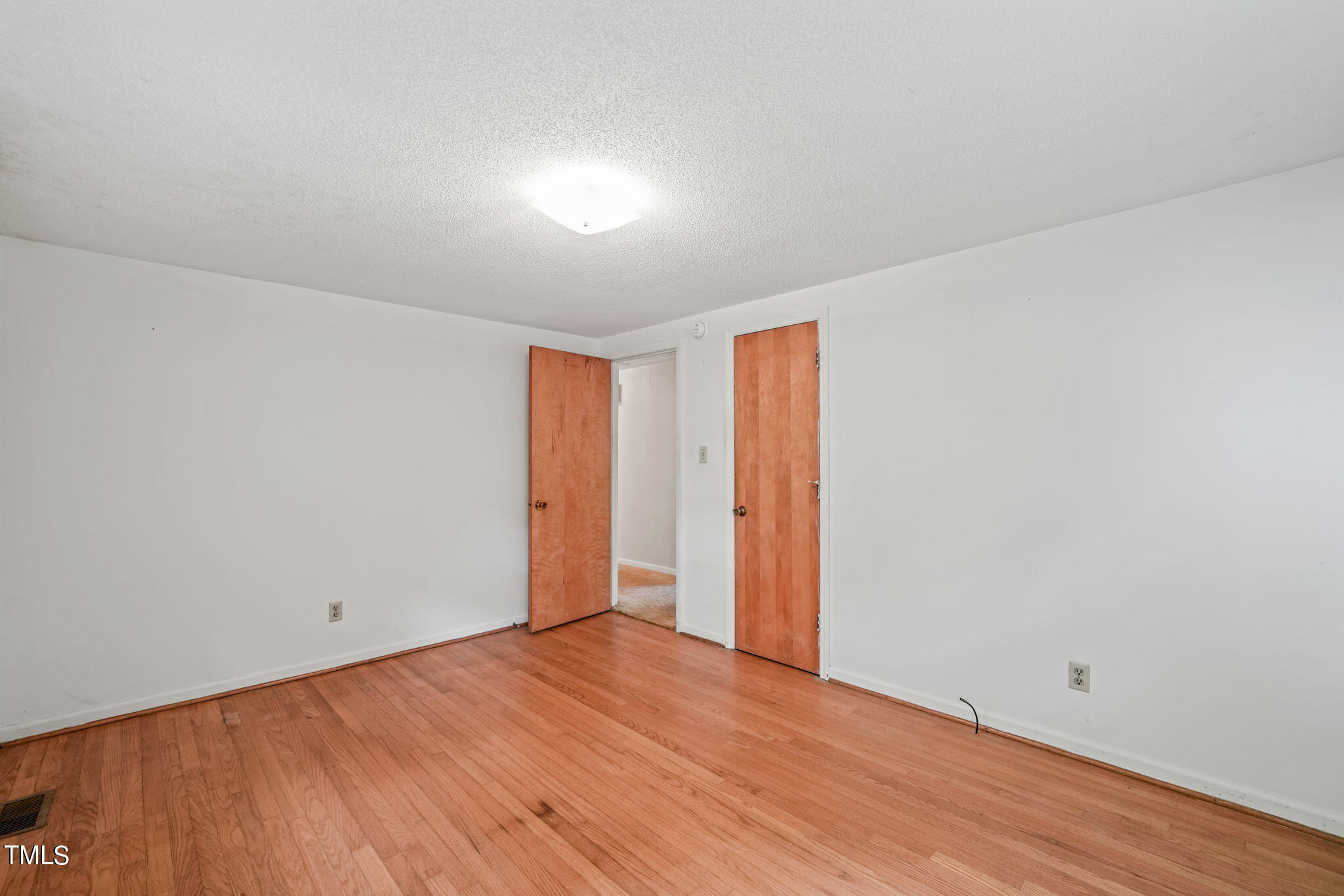 3015 Old Raleigh Road Apex, NC 27502 - Photo 25 of 47 a view of an empty room with wooden floor