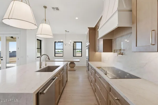 a kitchen with a sink stove and refrigerator