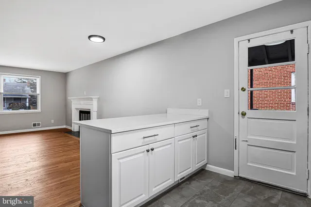 a utility room with cabinets dryer and washer
