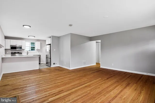 a view of kitchen with wooden floor