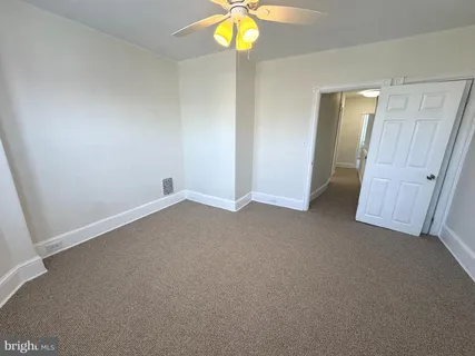 an empty room with a mirror