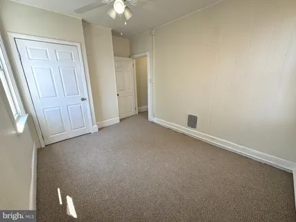 an empty room with a bathroom